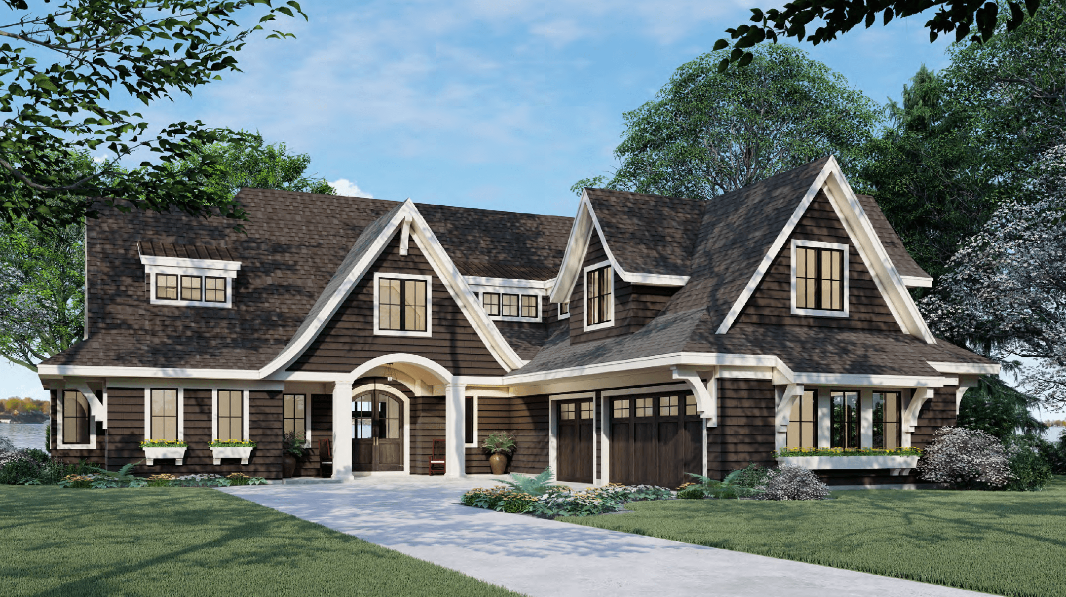 A brown home with a steep roof and white trim